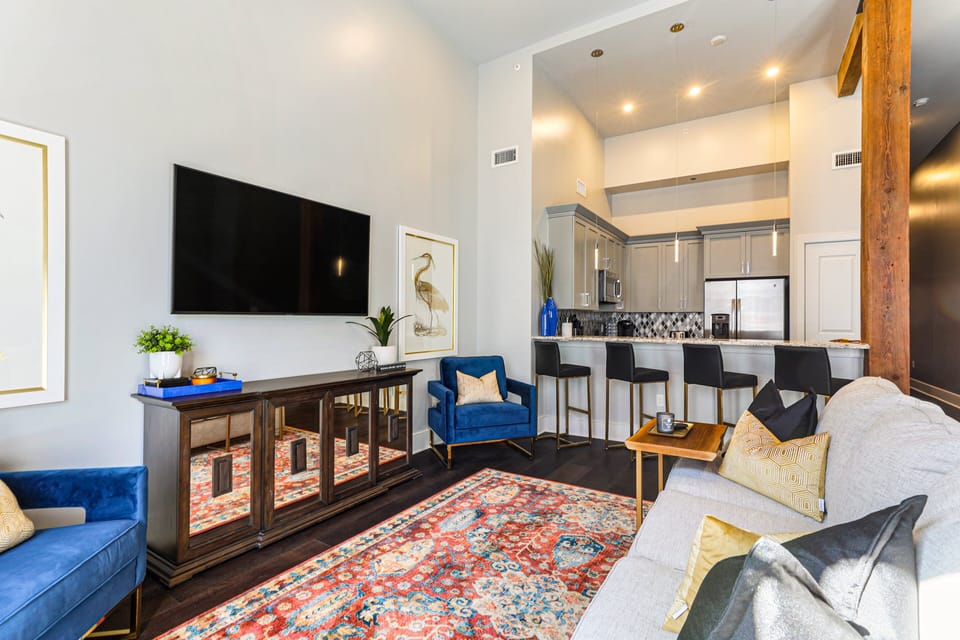 Open concept living, kitchen, and dining with plenty of seating. 65” Samsung Smart 4K TV for streaming and DIRECTV. Sofa converts to a queen-size sleeper. Dining table seats four. Enjoy lots of natural light!