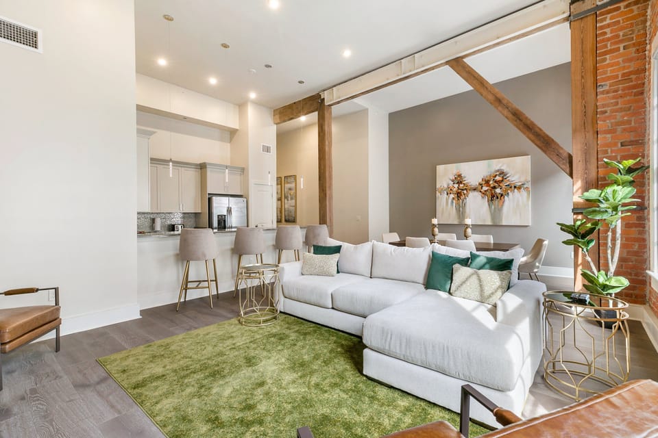 Open concept living, kitchen, and dining with plenty of seating. 65” Samsung Smart 4K TV for streaming and DIRECTV. Sofa converts to a queen-size sleeper. Dining table seats four. Enjoy lots of natural light!