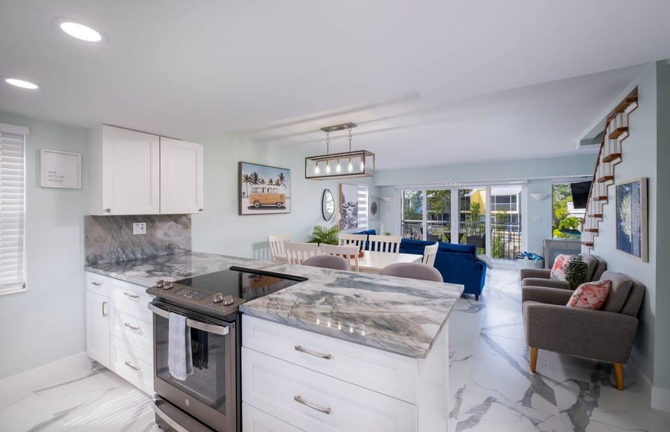 Kitchen, dining room, living room and screened in patio.