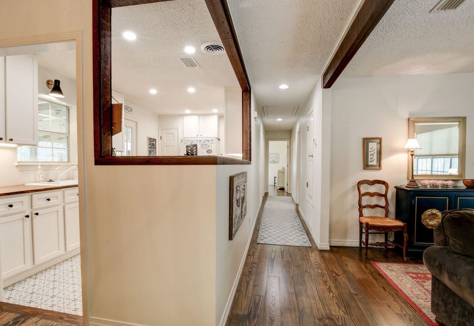 Hallway leading to bedrooms and bathrooms.