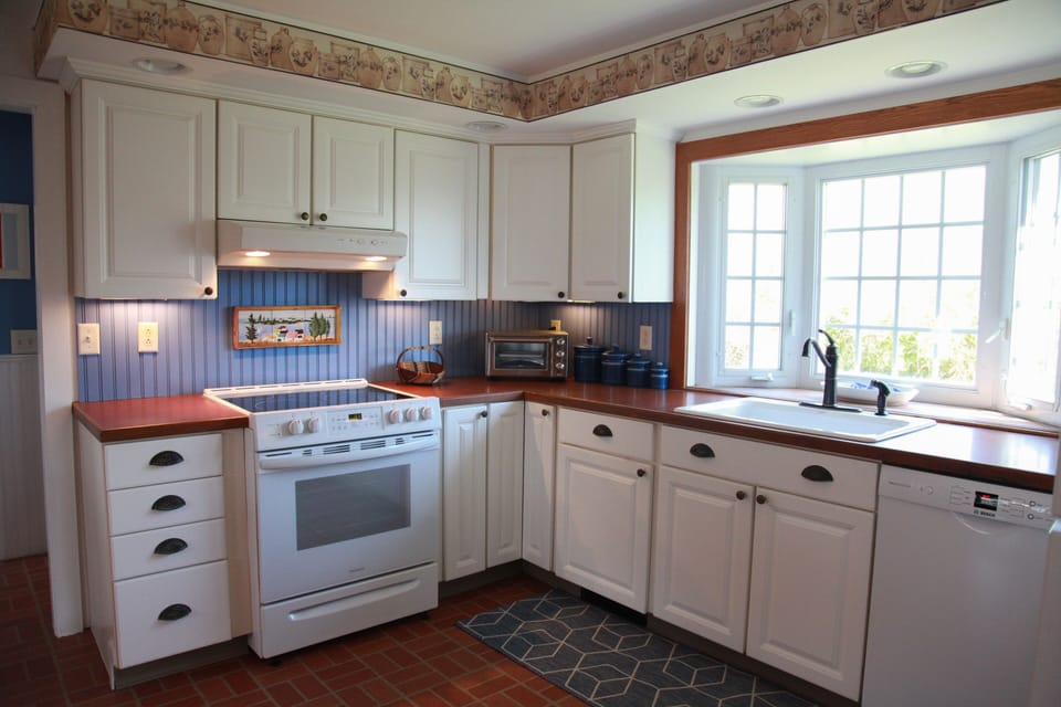 Country kitchen with all new appliances.