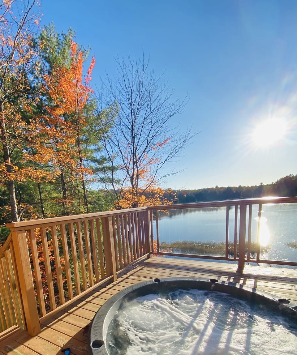 Hot tub overlooking lake perfect for sunsets