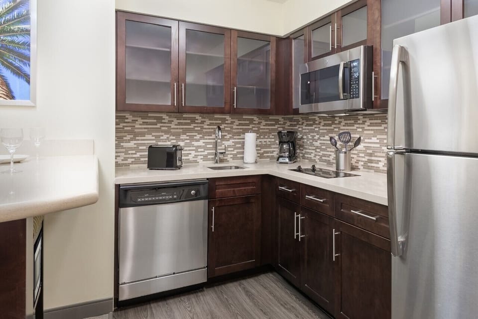 Cook with ease in the sleek kitchen with stainless appliances.