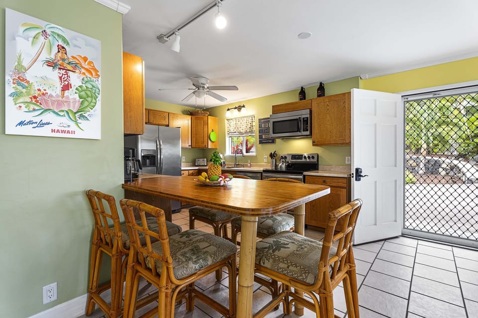 Share meals and conversation at the kitchen table with seating for five.