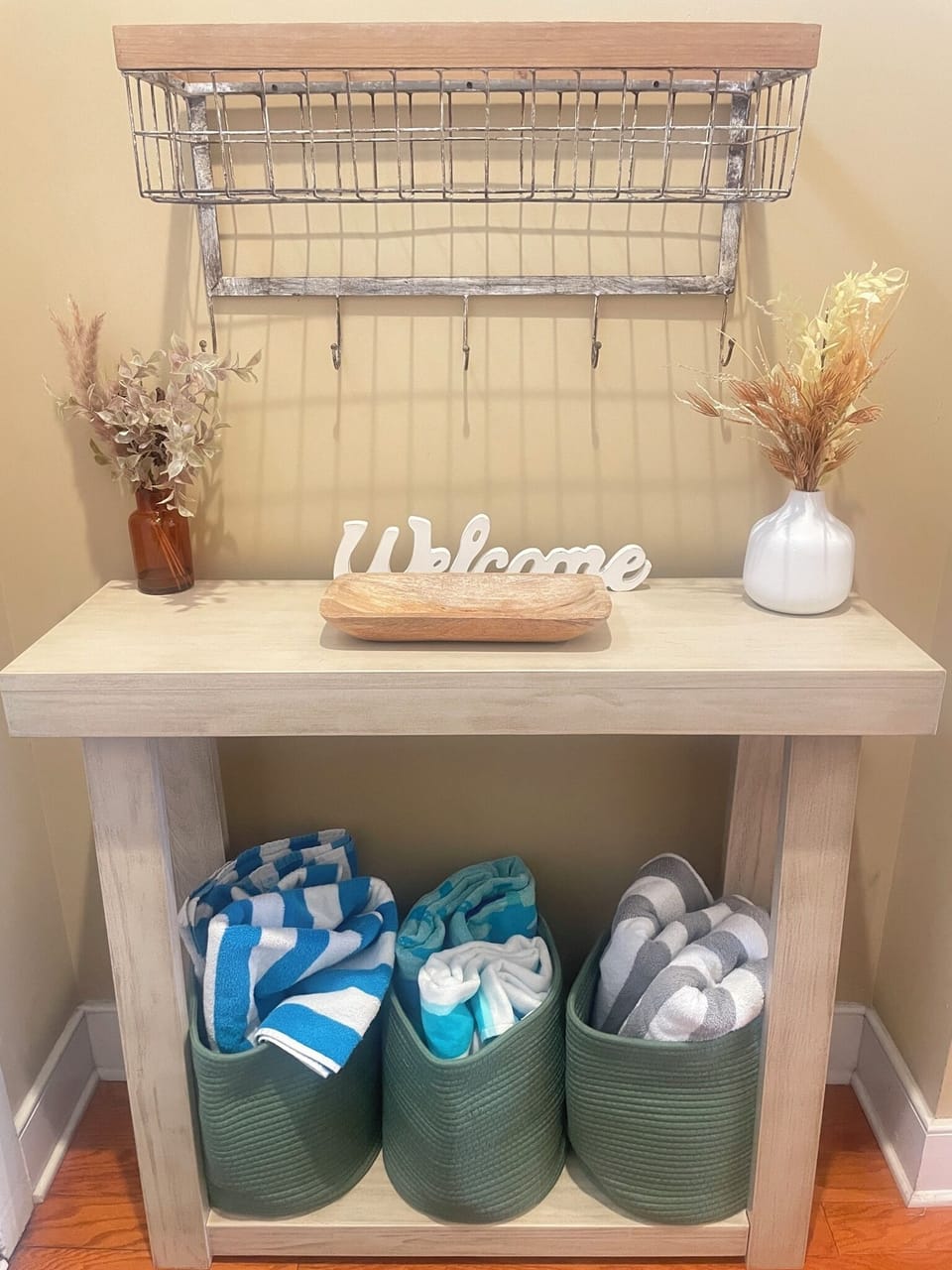 Welcome entryway table plus extra beach towels should you need!