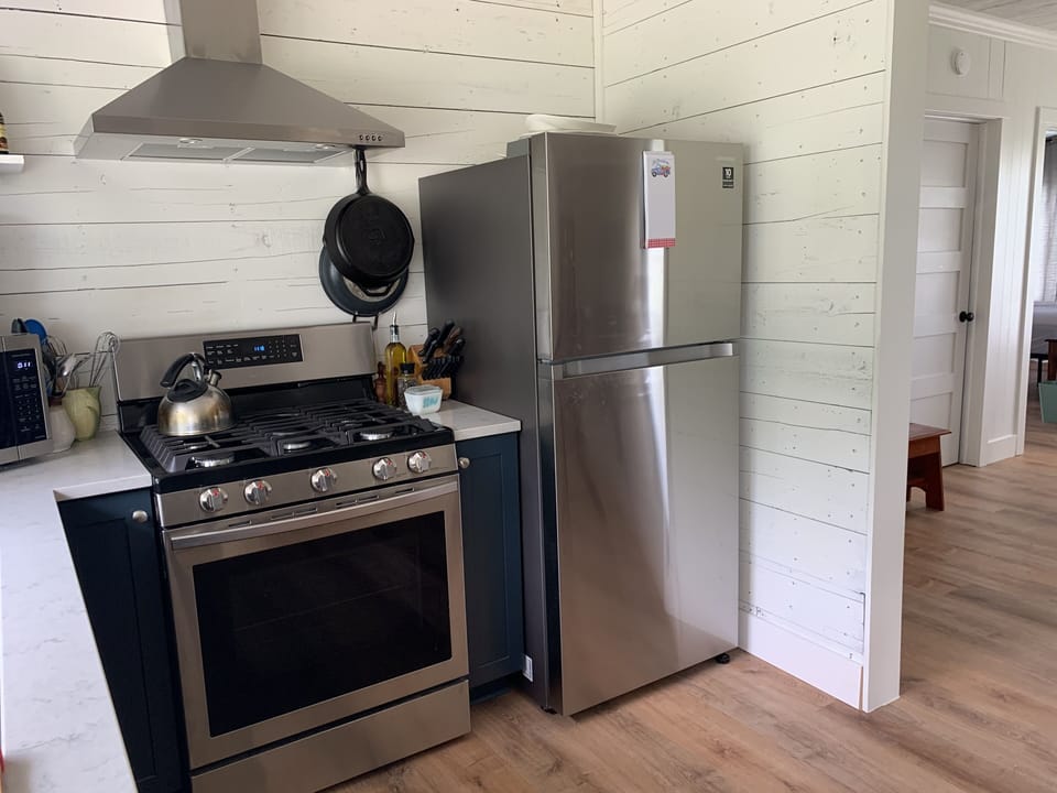 New kitchen cabinets and appliances with large farm sink and great views