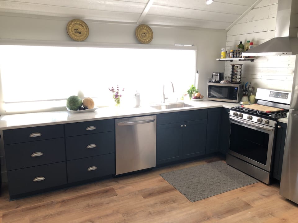Kitchen windows with electric blind for when you want it down!