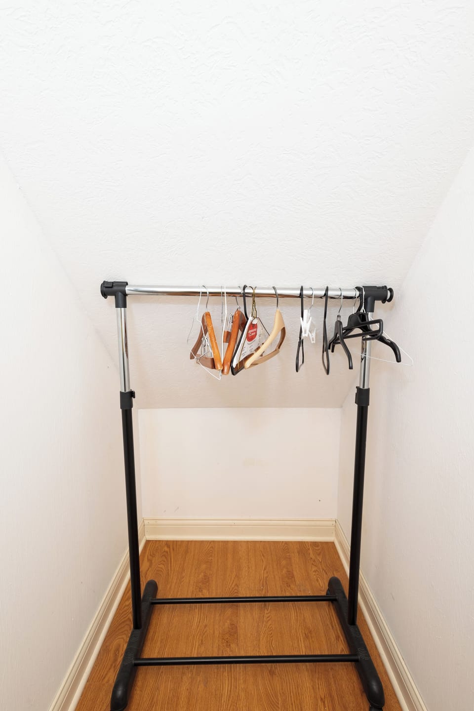Hanging storage in king bedroom closet.
