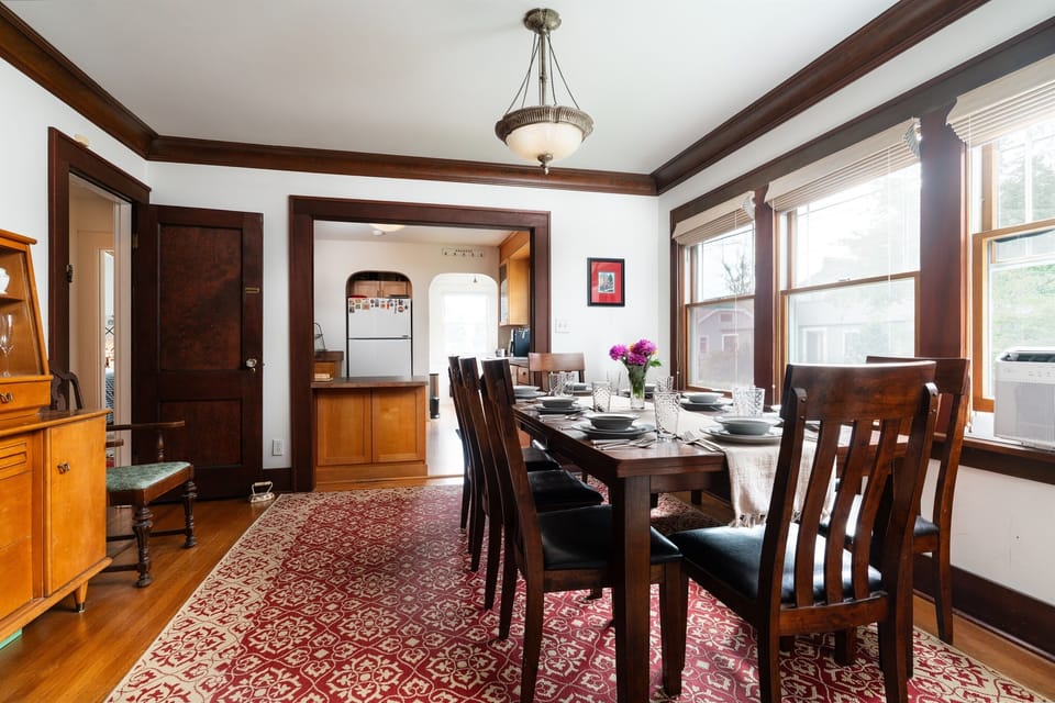 Dining room looking toward Kitchen. Hall to downstairs bedrooms and bath on the left. 