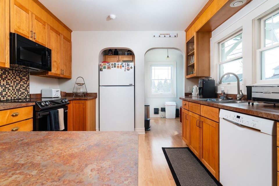 Fully equipped kitchen with dishwasher, induction stove, oven and large refrigerator