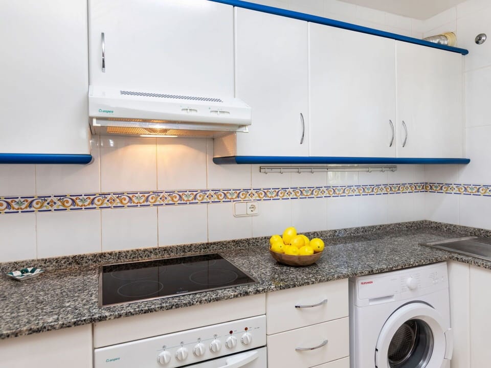 Cabinetry, Kitchen Stove, Kitchen, Countertop, Home Appliance, Kitchen Appliance, Cooktop, Interior Design, Major Appliance, Flooring