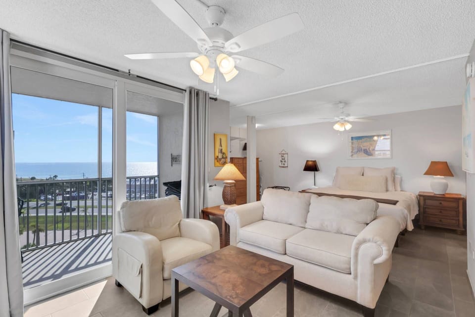 The bedroom space is open to the main living area with an awesome gulf view