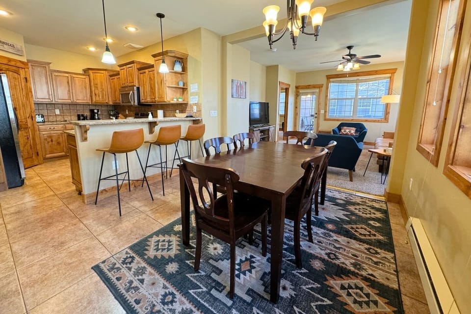 Chat at the island, lounge in the living room, or eat at the dining room table — this space is perfect for any guest's needs!