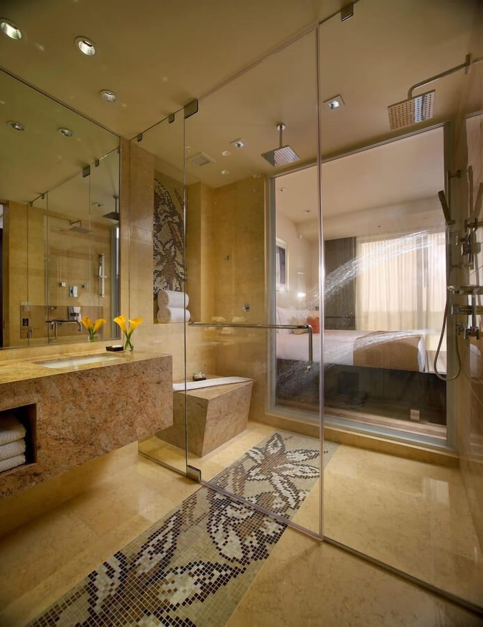 Rinse off in a sleek shower behind crystal-clear glass.