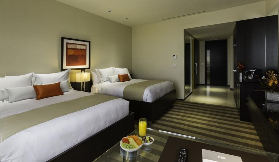 Unit with 2 Queen beds. Exact unit will be assigned upon arrival. Views, colors, and decor may vary.