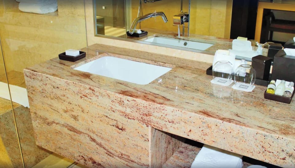 Enjoy thoughtful toiletries and plush towels at the sink.