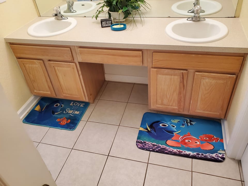 Second Floor Nemo Themed common bathroom with tub/shower.