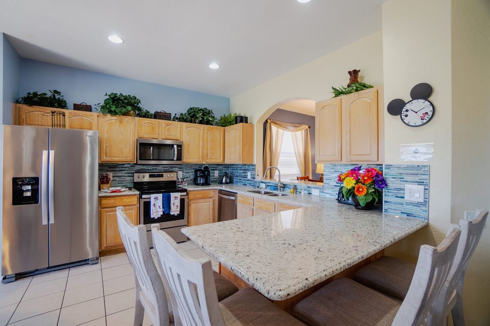 Large kitchen with counter-bar that seats four.  Upgraded granite counters.