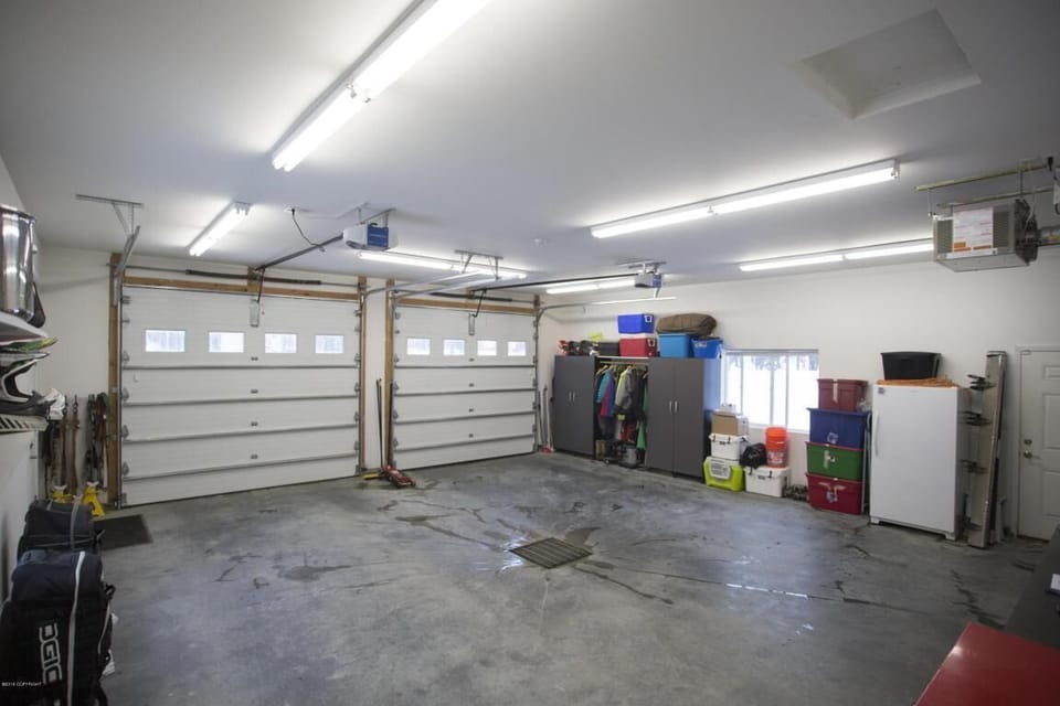 Attached garage with freezers. One large chest freezer is also available.