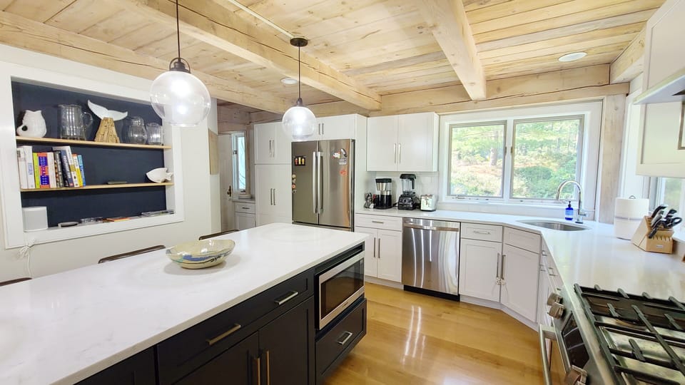 Bright kitchen is nicely equipped