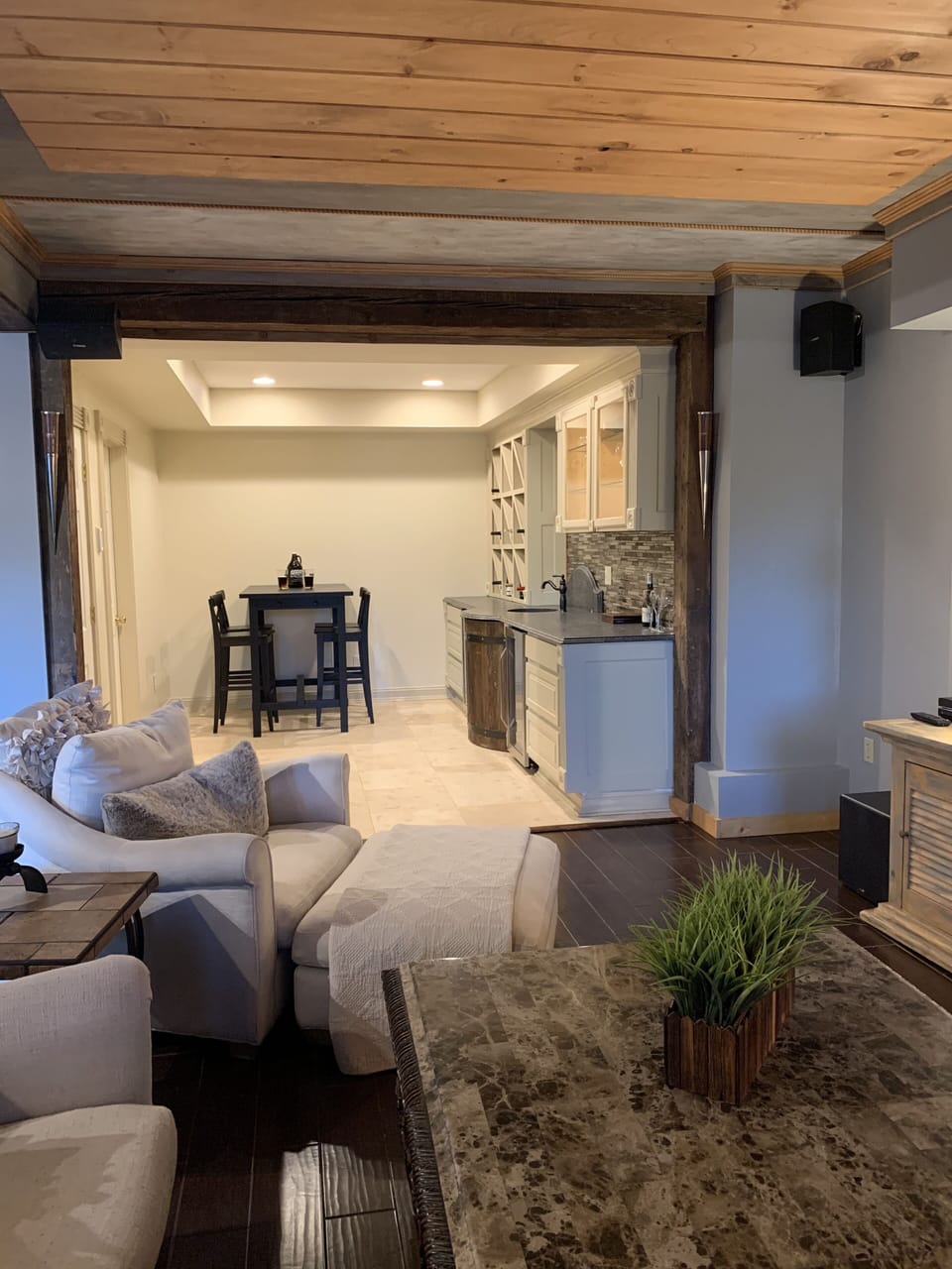 Wet bar and seating area. Equipped with wine fridge and humidor.
