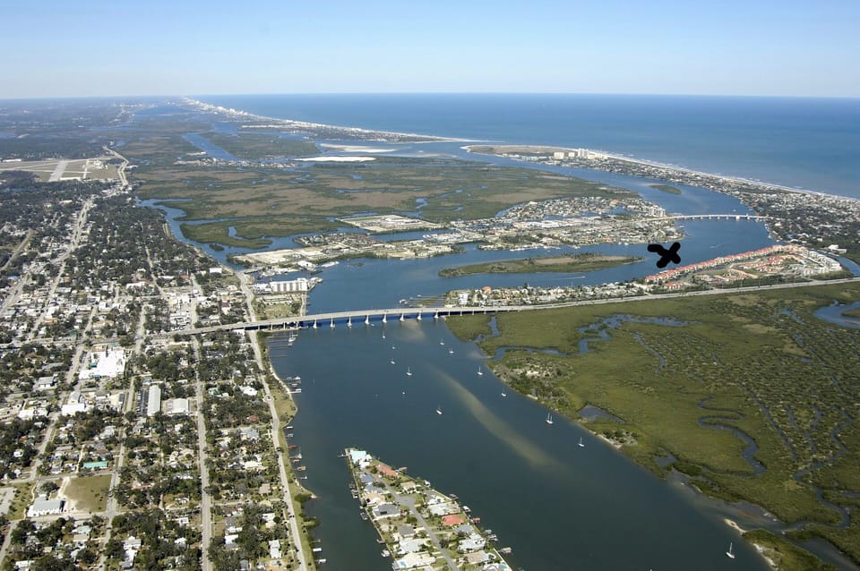 Beautiful New Smyrna Beach! The condos are on this side of X. Not on the water