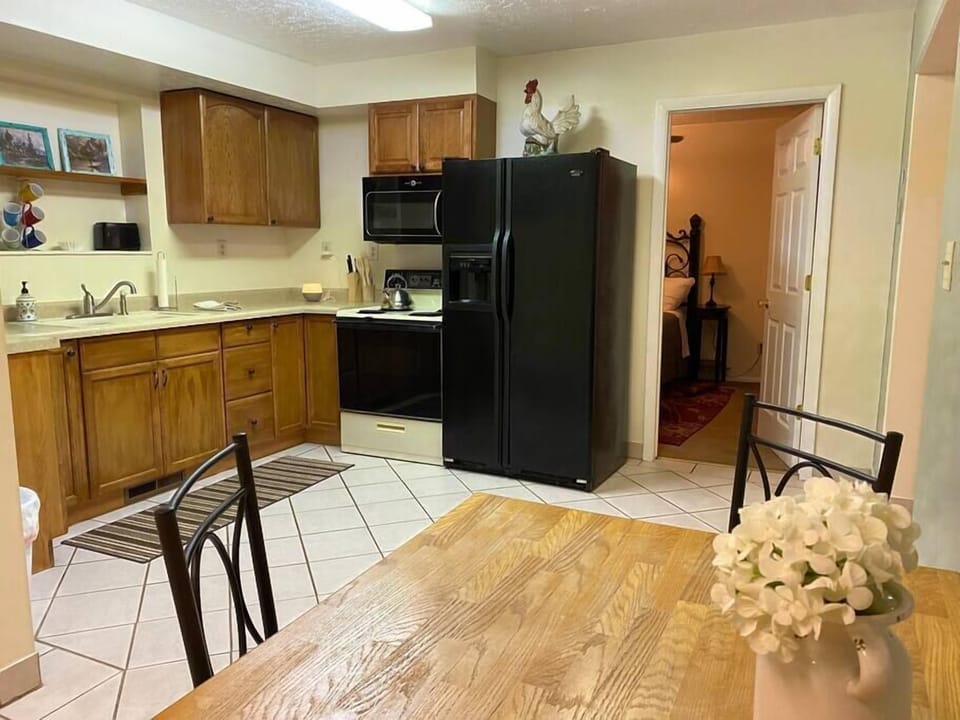Dining area with kitchen. Bedroom through the door.