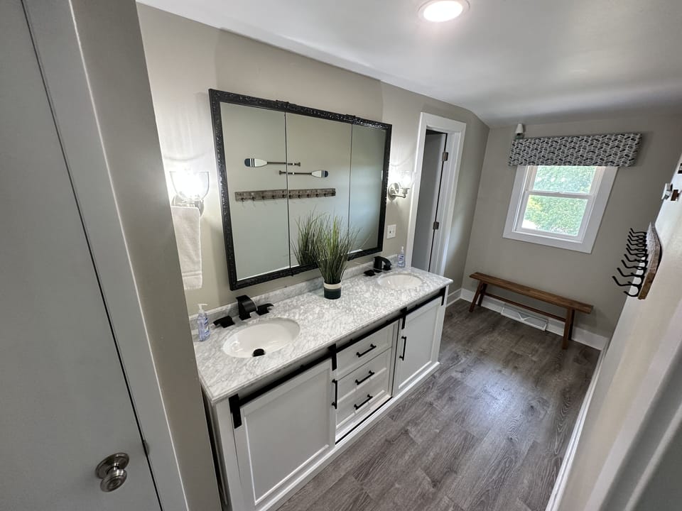 Closest bathroom to the 4 upstairs bedrooms.  Tub is through the door.