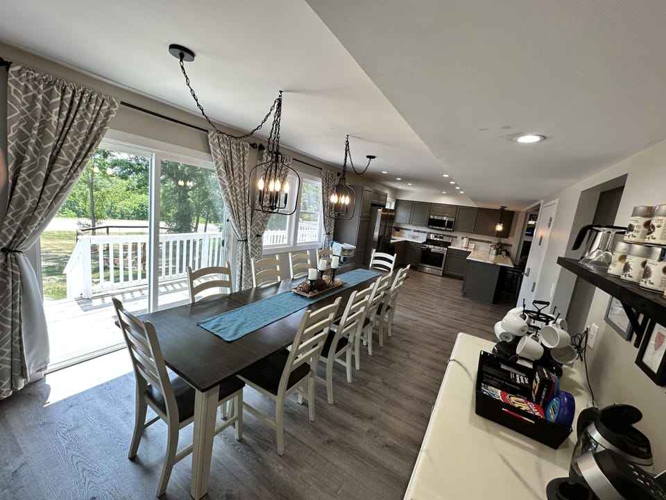 Additional dining for 10 off the kitchen and great room with a coffee bar.