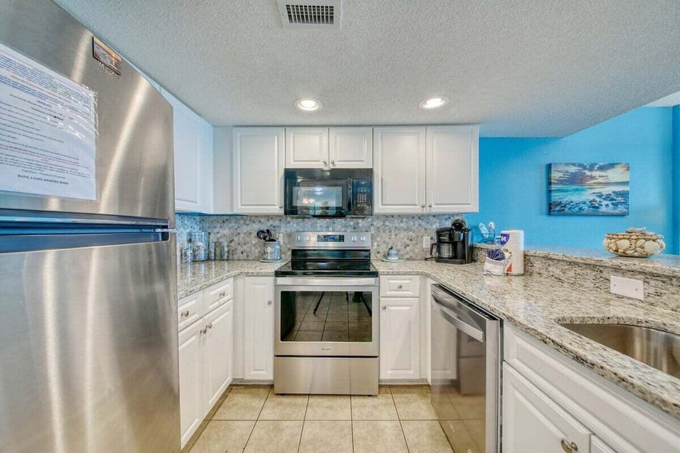 Stocked Kitchen with Beautiful Granite Countertops