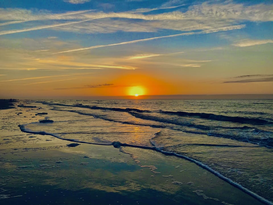 Sunrise on the beach in front of our condo! 