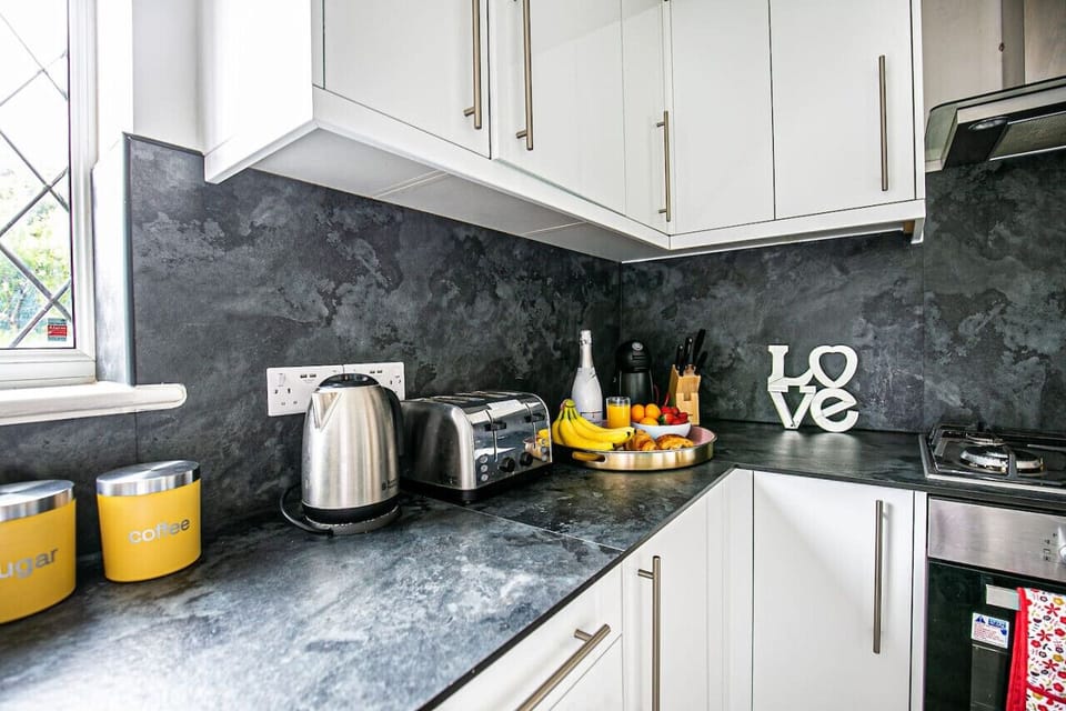 The fully equipped kitchen provides everything you need to prepare a delicious home-cooked meal, with modern appliances, ample cookware, and all the essential utensils to make cooking easy and enjoyable during your stay.