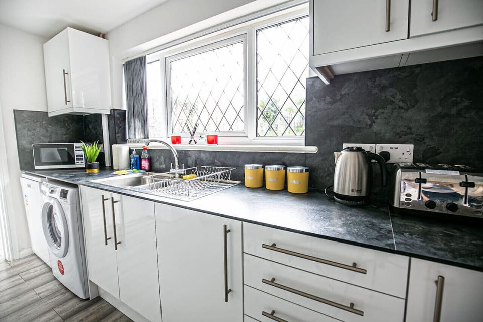 The fully equipped kitchen provides everything you need to prepare a delicious home-cooked meal, with modern appliances, ample cookware, and all the essential utensils to make cooking easy and enjoyable during your stay.
