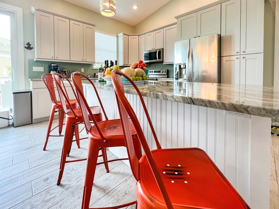 Gather around the heart of culinary delight—our kitchen island with seating for four. Here, conversations flow as effortlessly as the aromas of delicious creations, creating a central hub for both dining and camaraderie