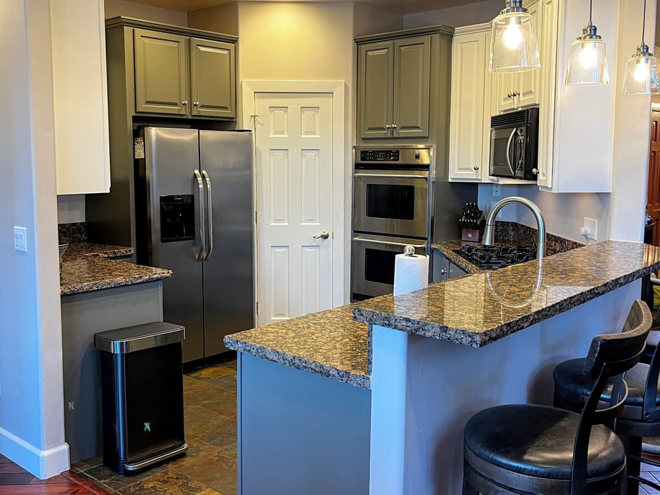 Full sized refrigerator, double ovens, a gas range, microwave, & pantry