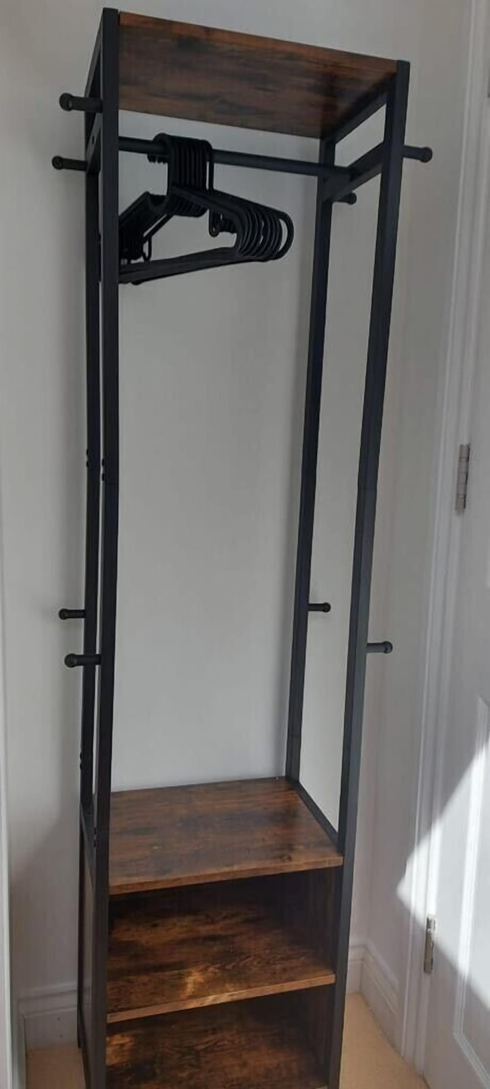 Clothes hanging storage in room 