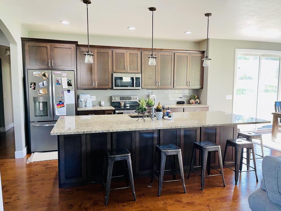 Large island with 6 stools. More stools available.