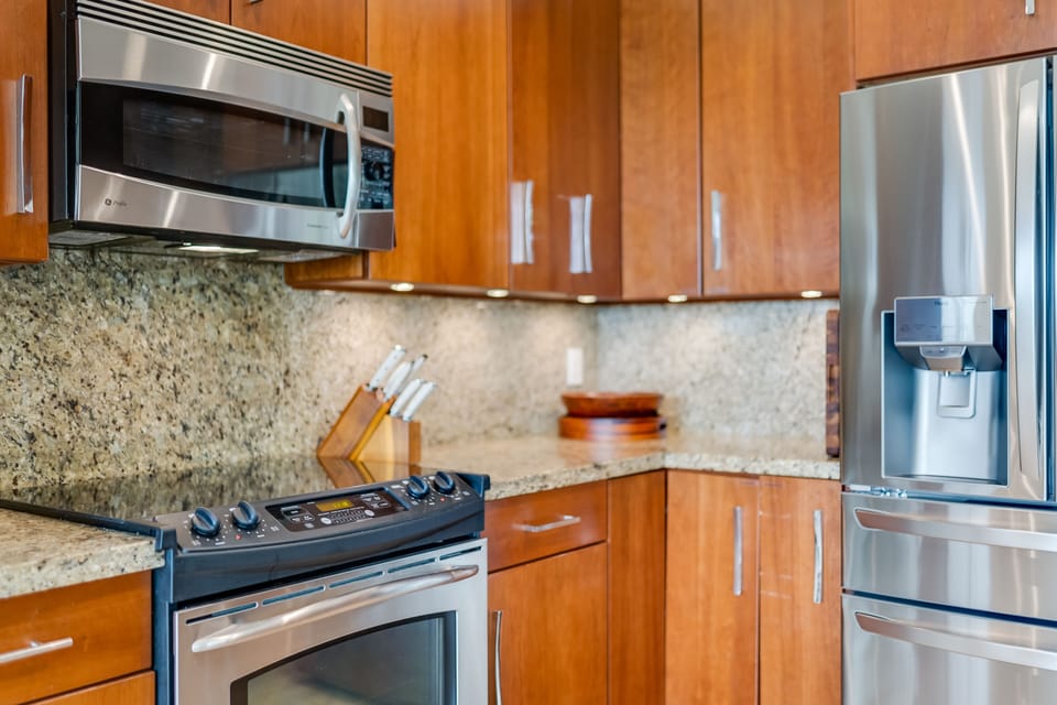 Modern kitchen with stainless appliances and granite countertops