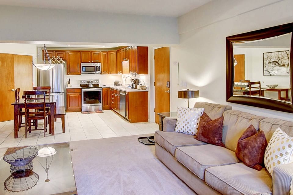 Open floor plan seamlessly connects the living room, dining area, and kitchen—perfect for relaxing and entertaining.