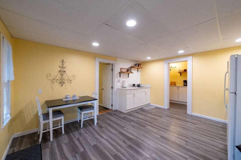 Eat-in kitchen with small table and chairs and sink