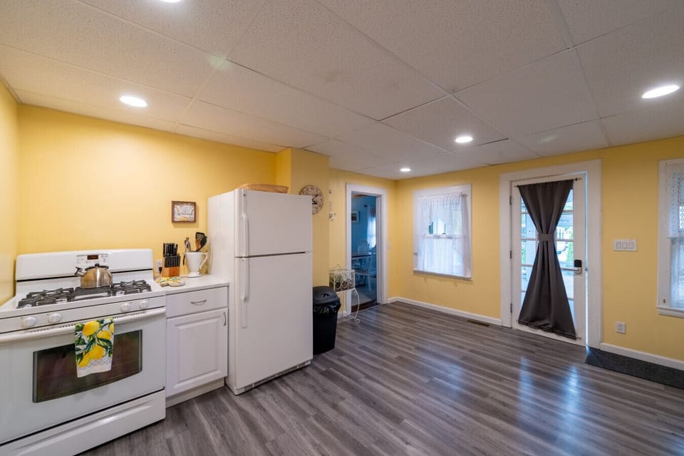 Kitchen area with oven and refrigerator