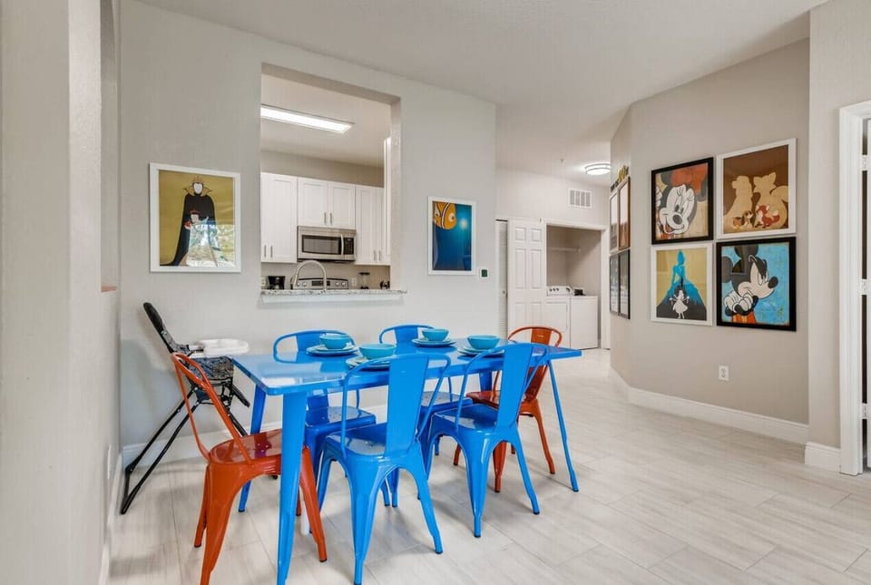 Modern open-concept dining with kitchen counter seating for casual bites and shared moments.