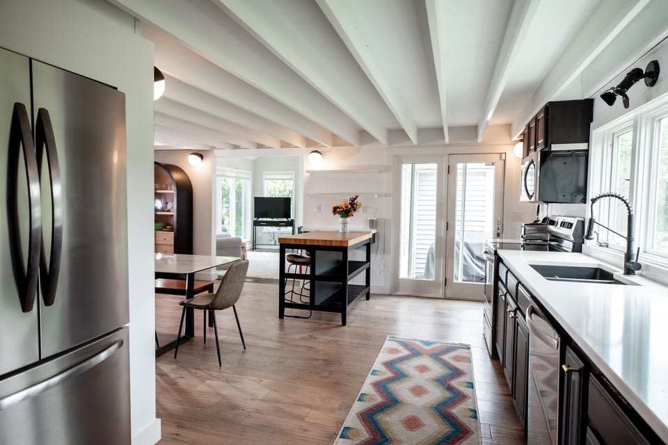 Updated appliances and modern furniture. 