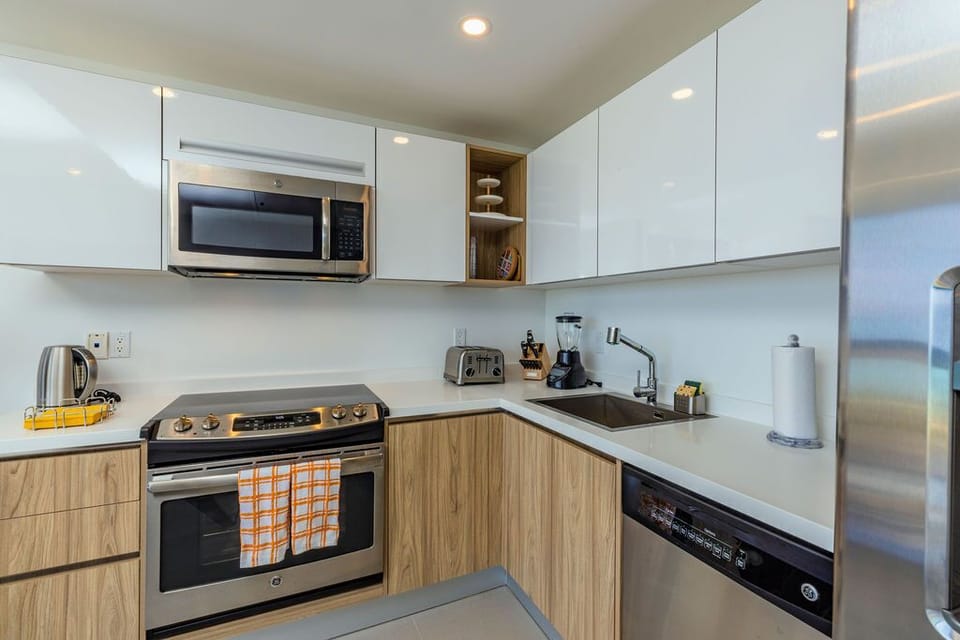 This bright, fully equipped kitchen has everything you need for a delightful stay—from crisp mornings brewing coffee to evenings cooking favorite meals in your home away from home.