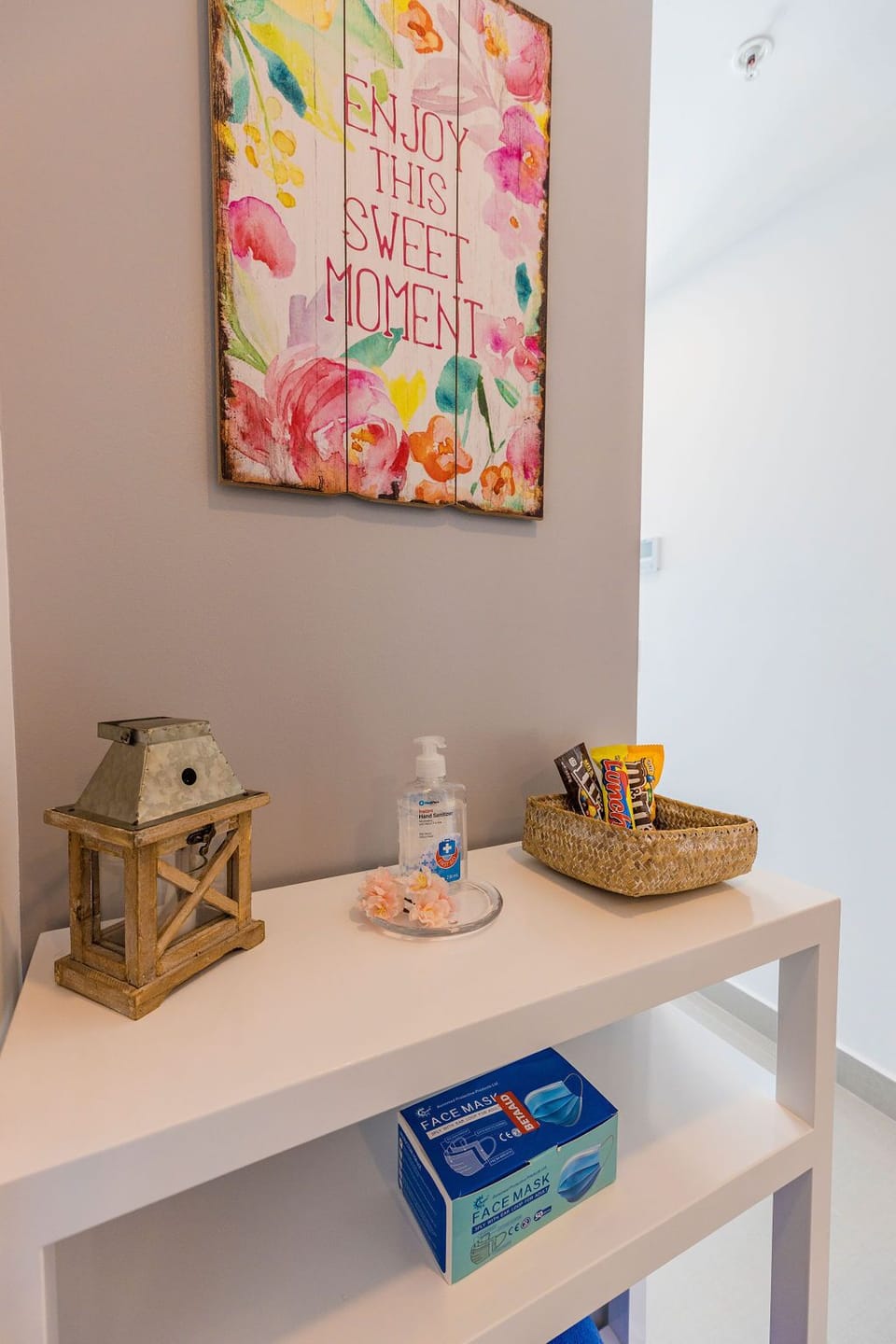 A welcoming space with thoughtful touches—sanitizer, masks, and snacks ready for your comfort and peace of mind as soon as you arrive.