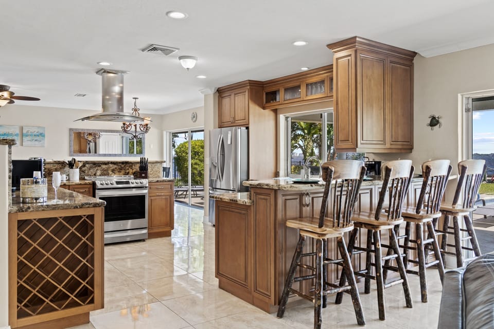 The kitchen is fully equipped & has room for 4 at the breakfast bar