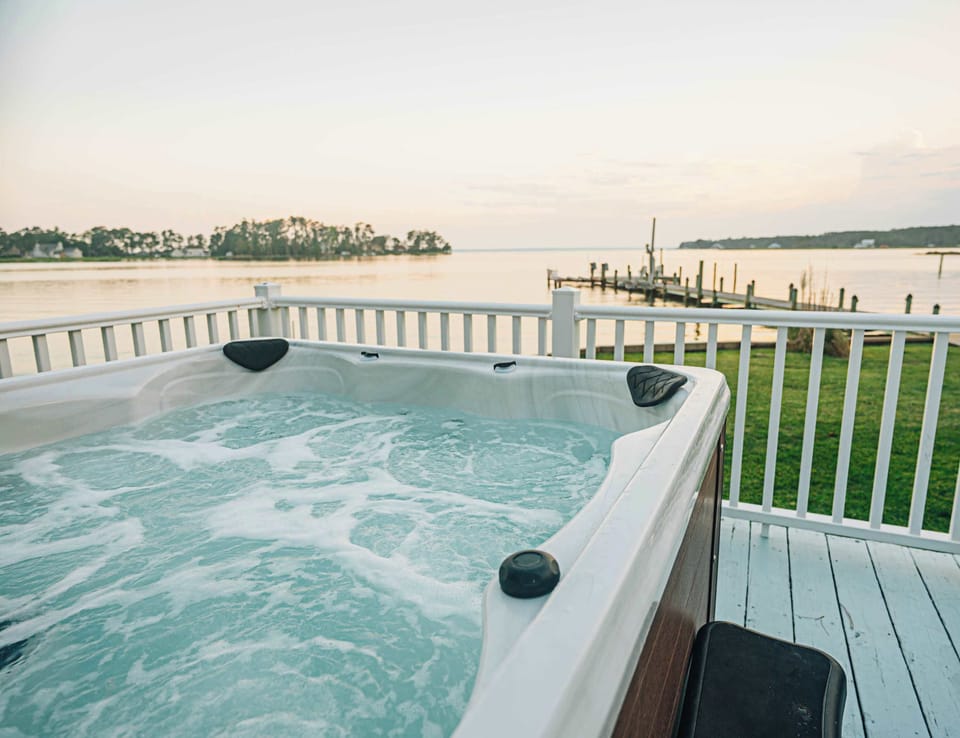 After a full day on the water or exploring our charming coastal towns, relax in the hot tub with a view Little Oyster Creek and Rappahannock River beyond. 