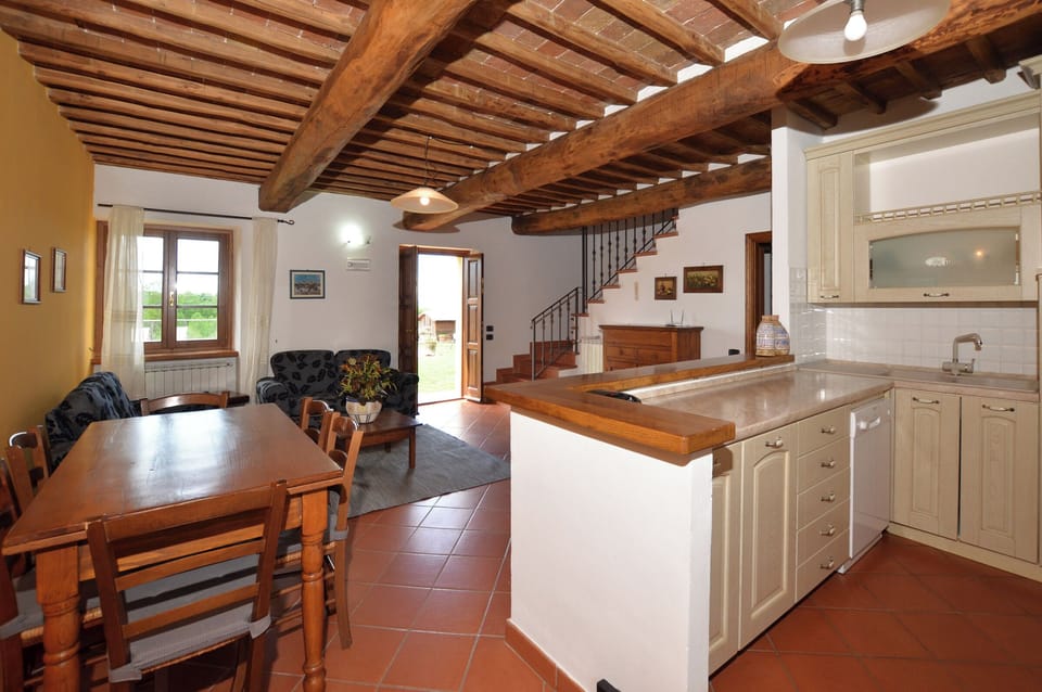 The living room with dining area and kitchen corner in the apartmnent 2