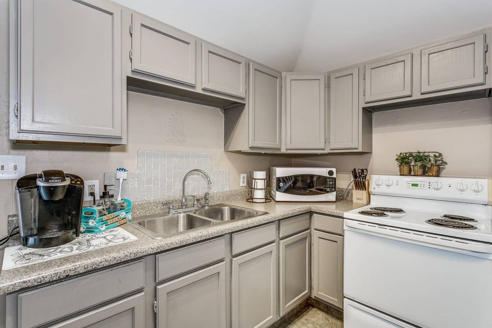 Charming kitchen has everything you need for a weekend away