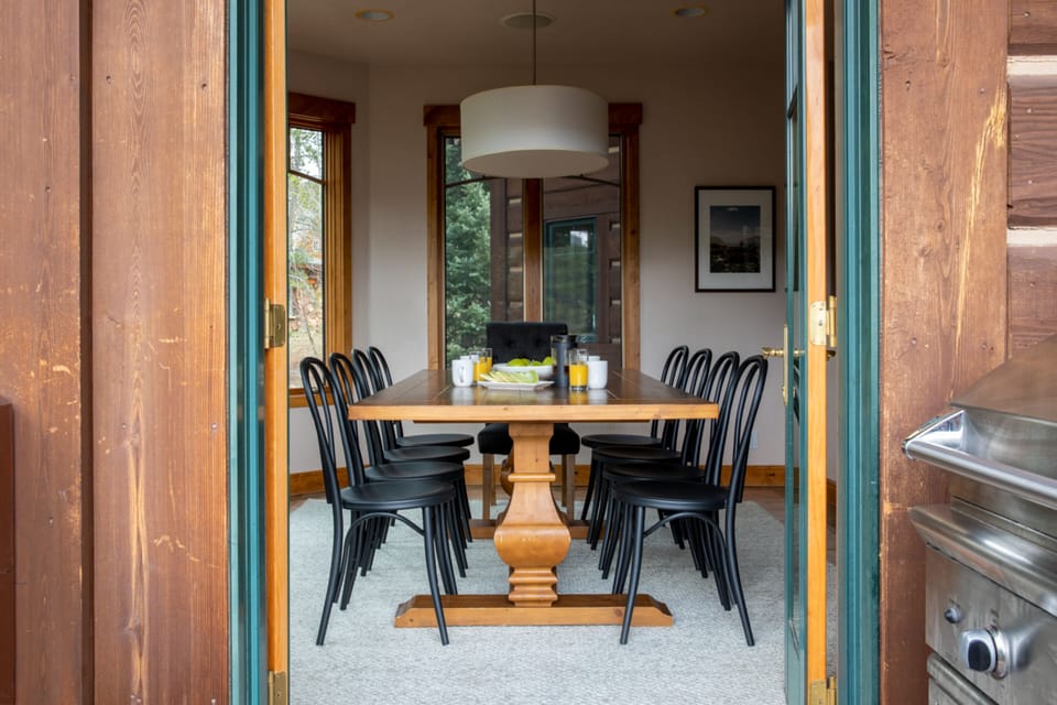 Dining opens to the deck and grill.